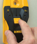 Hand using Stud Finder For Framing And DIY Projects Locates Three Quarter Inch Wood And Metal Studs With Center Find And LED Arrows