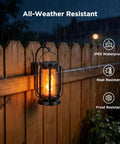 Lit Real Flame Solar Lanterns With USB Charging Four Modes Waterproof Outdoor Lights mounted on wooden fence in rain.