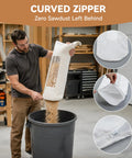 Heavy Duty Table Saw Dust Collector Bag With Clear View Window For 10 Inch Table Saws And 2 Point Five Inch Fittings in use, emptying sawdust, curved zipper.