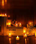 Rechargeable Flameless Tealight Candles Set 12 Pack With White Base And USB Charging Dock Flickering LED Tea Lights in a shelf display
