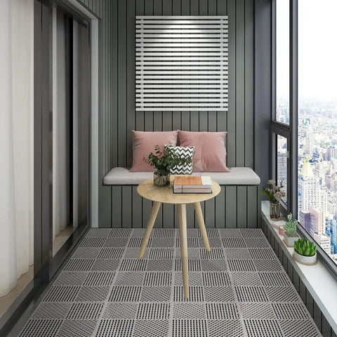 Interlocking Drainage Floor Tiles No Slip With Drain Holes For Pool Bathroom Shower Patio Boat And Pet Areas 12 Inch By 12 Inch By 0.4 Inch Thick Gray Durable Rubber Indoors Outdoors Easy Install installed on balcony floor.