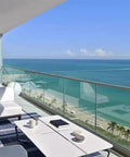 Heavy Duty Aluminum Glass Railing Spigot Kit Tough As Nails Deck And Balcony Support Clamps No Sweat Floor Or Side Mount For 10 To 17 Mm Glass Panel Pool Fence overlooking beach view.