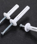 One Quarter By Three Inch Plastic Hammer Drive Nail In Anchors For Concrete And Masonry, 100 Pieces Per Box, close-up view