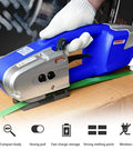 Powerful Portable Electric Strapping Machine With Battery Power For Pet Pp Straps securing green strap on cardboard box.