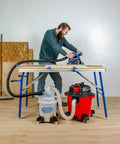 Dust Deputy Low Profile Space Saving Deluxe Lid Dust Separator Kit With Clear Five Gallon Bucket connected to a shop vacuum in use