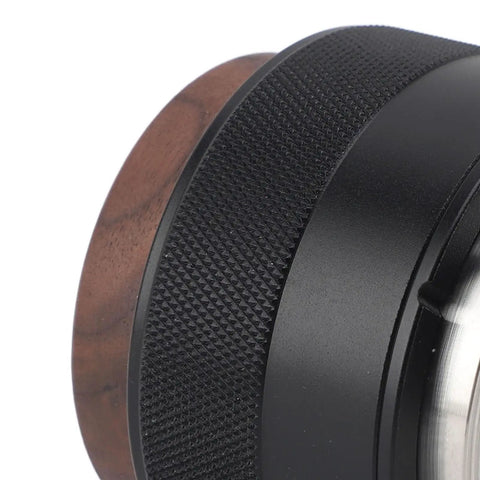 Top Tier 51Mm Black Coffee Distributor And Espresso Tamper For Baristas Stainless Steel Tool, ergonomic grip detail.