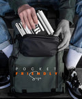 Person placing compact Motorcycle Wheel Roller Stand in backpack, silver color, showcasing portability for easy maintenance.