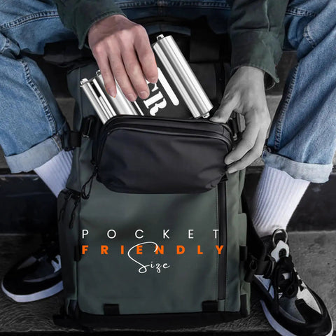 Person placing compact Motorcycle Wheel Roller Stand in backpack, silver color, showcasing portability for easy maintenance.