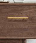 Gold Kitchen Cabinet Door Pull Handles 128mm Metal Cabinet Hardware Set for Drawers Close-up on Wooden Surface