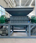 Heavy Duty Dual Shaft Tire Shredder Machine For Fleet Trucks And Standard Cars Ultimate Rubber Recycling Grinder side view with large feed hopper.