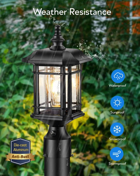 Dusk To Dawn Outdoor Post Light Black Finish Hardwired 120V Lantern With Pier Mount Base shown in garden setting