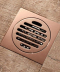 Rose Gold Bathtub Stopper With Anti Odor Shower Floor Drain Valve Heavy Duty Brass Waste Gate Featuring A Slick Finish and installed on bathroom floor.