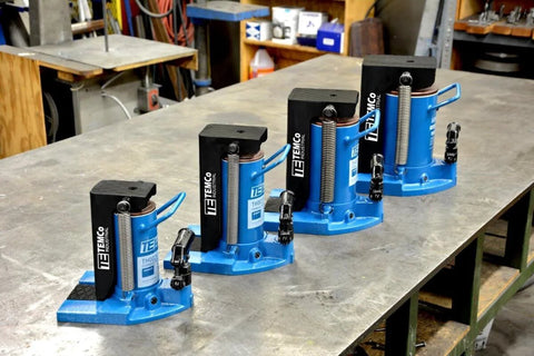 Heavy Duty Toe Jack Hydraulic Floor Lift For Containers And Machinery, 5 To 10 Ton Capacity, Ultra Low 0.875 Inch Clearance, displayed in a workshop
