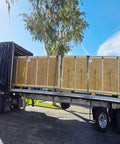 Flatbed truck with boxes secured using 20 Pack 4 Inch Edge Protectors For Flatbed Trucks With Mesh Carrying Case, Yellow Plastic Corner Guards