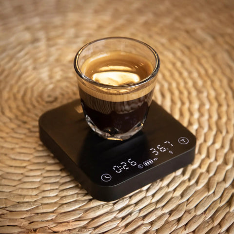 Exagram Pro Coffee Scale with Timer and Carrying Box Smart Espresso Scale showing espresso cup with digital readout on wicker surface