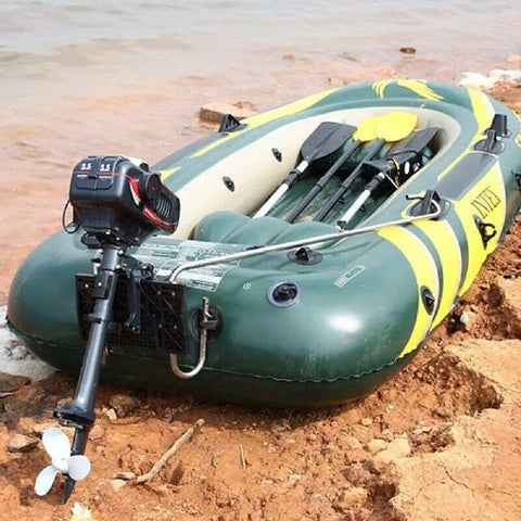 Powerful 3.5HP 2 Stroke Outboard Motor with Water Cooling System attached to inflatable boat on rough riverbank