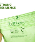 Hands stretching green 8 Gallon Compostable Drawstring Kitchen Waste Trash Bags Heavy Duty 1 Mil Tear Free 30 Count Biodegradable BPI Certified OK Compost Industrial