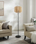 Nourish Bamboo Floor Lamp In Natural Finish With Basket Weave Two Tier Shade Modern Iron Base On Off Switch LED Compatible E26 60W Max Bulb Not Included Perfect Cozy Vibes For Living Room Or Bedroom next to beige sofa in living room