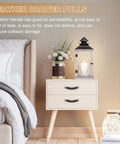 Bedroom scene with nightstand featuring leather drawer pulls 4 pack white microfiber leather dresser knobs with double hole mounting and included screws