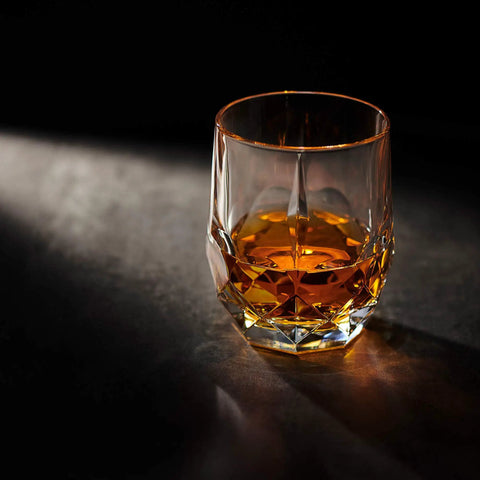 Eco Crystal Whiskey Gift Set With Handcrafted Granite Chill Stones And European Style 11.7 Oz Tumbler on dark surface