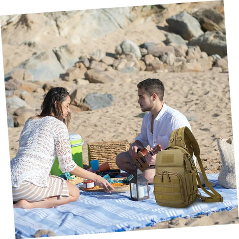 Camouflage Oxford Cloth Outdoor Fishing Backpack with large capacity by a beach picnic setup with two people on a blanket.