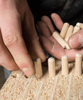 Beefy Beechwood Dowel Pins For Woodworking 200 Pcs Fluted Dowels Quarter Inch By One And A Quarter Inch Hardwood Craft Pegs being installed