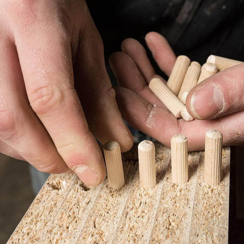 Beefy Beechwood Dowel Pins For Woodworking 200 Pcs Fluted Dowels Quarter Inch By One And A Quarter Inch Hardwood Craft Pegs being installed