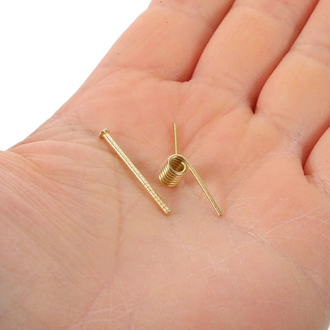 8 Pack Hair Clip Spring Replacement showing golden steel spring parts in a hand for DIY hair accessories and crafting projects