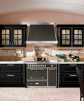 Modern kitchen with black cabinets and stainless steel appliances, featuring Five Pack Matte Black Cabinet Knobs for Cabinets and Drawers.