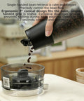 Smart Vacuum Coffee Bean Storage Canister With Digital Temp And Humidity Gauge 650Ml pouring coffee beans into a scale.