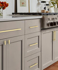 Gold Cabinet Pulls 5 Inch Center To Center 6.4 Inch Overall Length Brushed Gold Drawer Hardware in kitchen setup