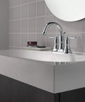 Westchester Centerset Chrome Bathroom Sink Faucet With Drain Assembly Included on a modern countertop in a tiled bathroom.