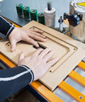 No Sweat Router Table Insert Plate Template Kit With Solid Density Board Quickset Threaded Inserts And Razor Sharp Flush Trim Blade For Standard Nine By Eleven Inch Garage Shop Builds on workbench with hands guiding