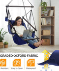 Deluxe Hanging Hammock Sky Chair for Chill Sessions with Pillow and Drink Holder, navy blue with solid wood spreader bar.