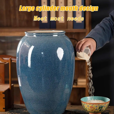 Grab This Solid Ceramic Rice Container With a Tight Seal, Heavy Duty 25kg Grain Dispenser for Your Kitchen Grub Stash, Blue White Porcelain Tea Coffee Bean Jar with a large cylinder mouth design, pouring rice.