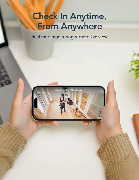 Hands holding smartphone showing live feed from 2.4GHz Indoor Security Camera System 1080P Home Surveillance Kit With Motion Detection.