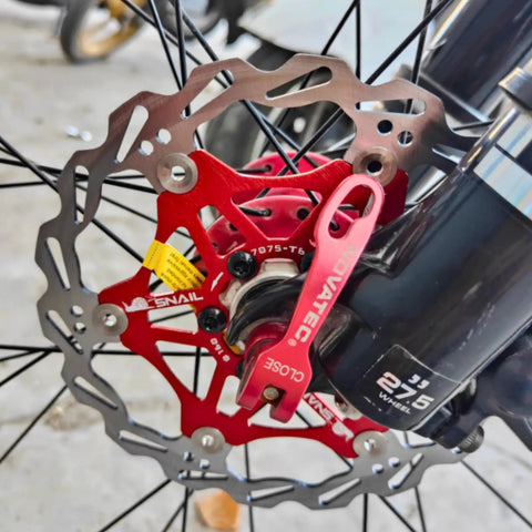 Floating Bike Brake Disc Rotor For MTB Road BMX 160mm with stainless steel outer and 7075 aluminum inner, mounted on bike.
