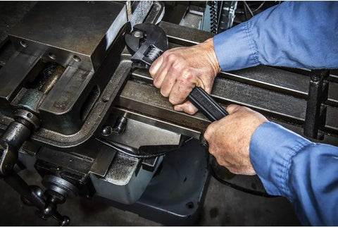 Mechanic using Heavy Duty Adjustable Black Oxide Wrench With Tapered Handle And Hex Jaw Design For No Slip Grips, 15 Inch