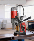 Magnetic Drill Press for Core Drilling and Metal Hole Cutting on steel, showcasing strong magnetic base and adjustable handle.