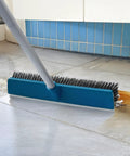 16 Inch Push Broom With Rubber Squeegee And 58 Inch Long Handle 2 In 1 Heavy Duty Outdoor Broom cleaning grime on concrete floor