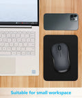 Small Mouse Pad 8 By 6 Inch Thick Rubber With Premium Textured Non Slip Surface next to laptop and smartphone on desk