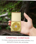 Hand holding Small 10cm Alloy Feng Shui Compass With Flip Cover, Waterproof Outdoor Navigation Tool for Camping, in forest setting
