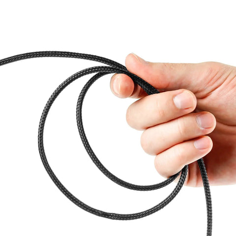Person holding black braided cable from 96 Ft Braided Cable Sleeve Kit With Heat Shrink Tubes for Audio and Video Cables Expandable Wire Loom