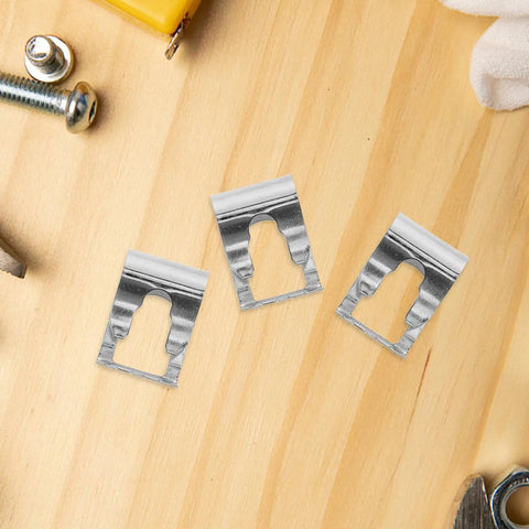 Universal Auto Windshield Wiper Linkage Repair Clips Kit Built Tough With Heavy Duty Stainless Steel showing three clips on wood.