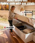Woman lifting RV bed with 20 Inch Gas Struts With Brackets, 100 Lb Lift, 445N Heavy Duty Lift Support For RV Beds, Trailer Doors, And Storage Lids