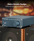 Front view of V1.0G 2 Channel Class D Mini Stereo Amplifier for Home Speakers with a retro design, on a speaker.