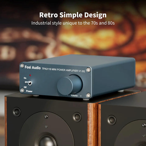 Front view of V1.0G 2 Channel Class D Mini Stereo Amplifier for Home Speakers with a retro design, on a speaker.