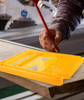 Versatile Woodworking Table Saw Extension Guide And Extended Featherboard Safety Jig on wood surface with a hand using a pencil.