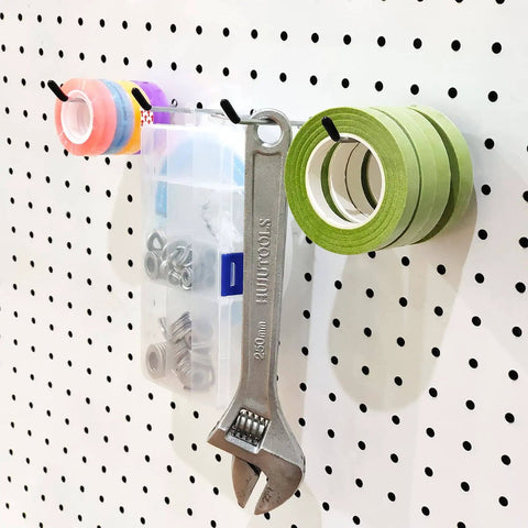 4 Inch Pegboard Hooks 25 Pack Pegboard Organizer Kit For Garage Storage And Tool Workshop Organization, Heavy Duty L Shape Hooks With 20lb Capacity Fits Standard Pegboards At Home Or Shop holding tools and tape rolls on a pegboard