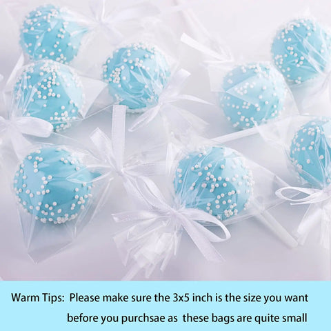 Clear 3x5 Inch Cake Pop Bags With Twist Ties holding blue cake pops, 100 Pack, Food Safe Cellophane Bags For DIY Party Favors And Gift Wrapping